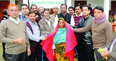 RANGPUR: President of Rangpur Chamber of Commerce and Industry Abul Kashem distributing blankets with the assistance of FBCCI, DCCI and Standard Bank Ltd at RCCCI Public School & College ground on Saturday.