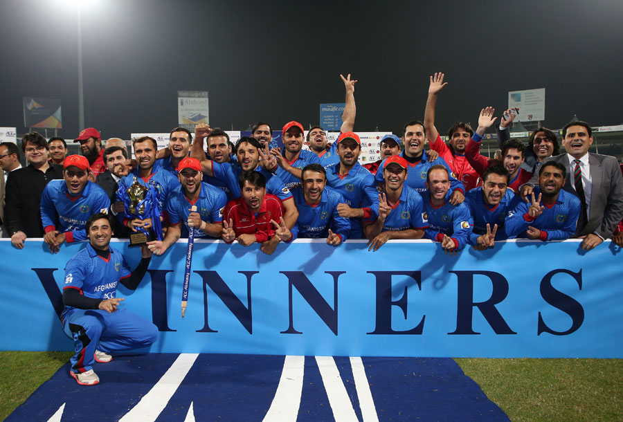 The Afghanistan team pose for a photograph after beating Zimbabwe in 2nd T20I at Sharjah on Sunday.