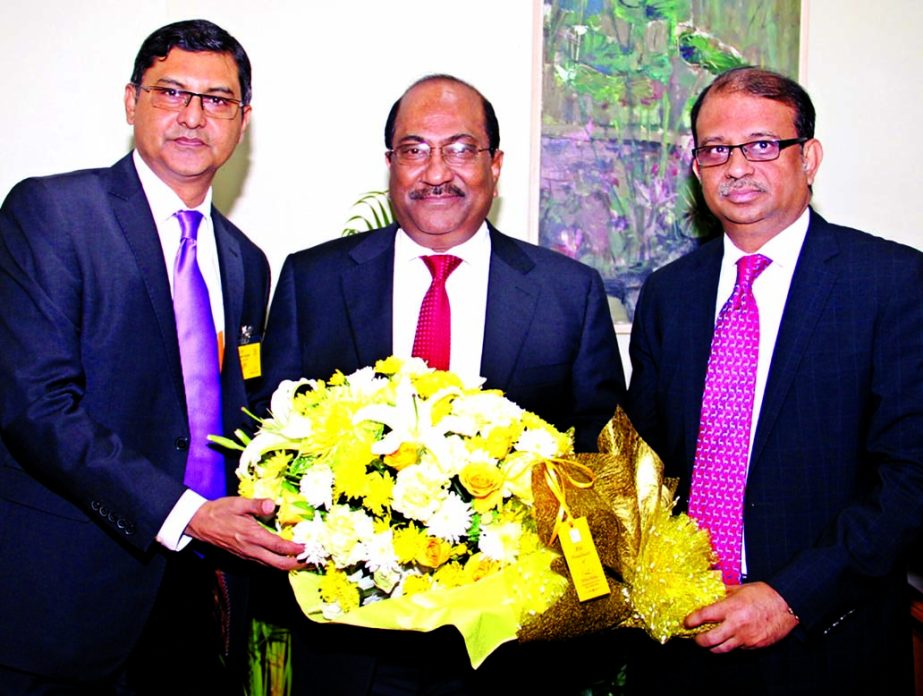 Ali Reza Iftekhar Managing, Director of Eastern Bank Ltd (right) presenting a bouquet to SK Sur Chowdhury, Deputy Governor of Bangladesh Bank on his receiving of Integrated Crop Management (ICM) Award 2016 at latter's office on Tuesday. Ziaul Karim, Head