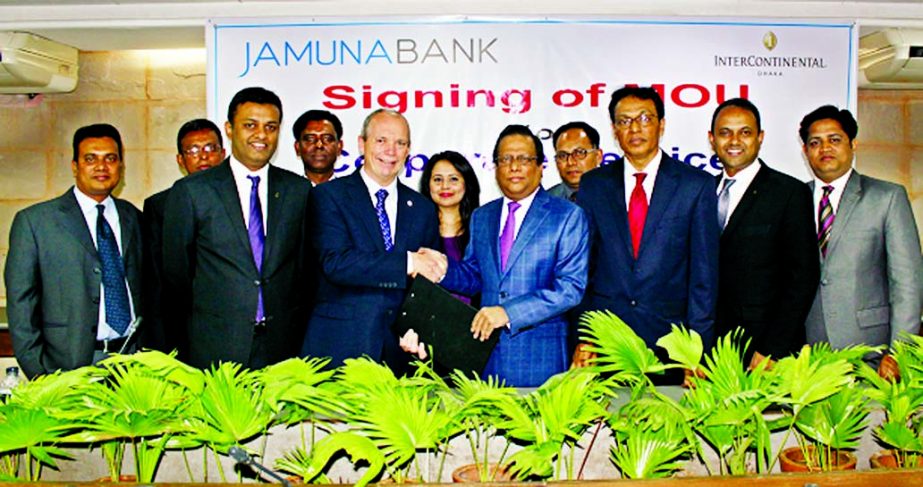 Shafiqul Alam, Managing Director of Jamuna Bank Limited and James P McDonald, General Manager of Intercontinental, Dhaka sign an agreement at the bank's head office on Tuesday. Under this agreement, international credit card holder of the bank will get B