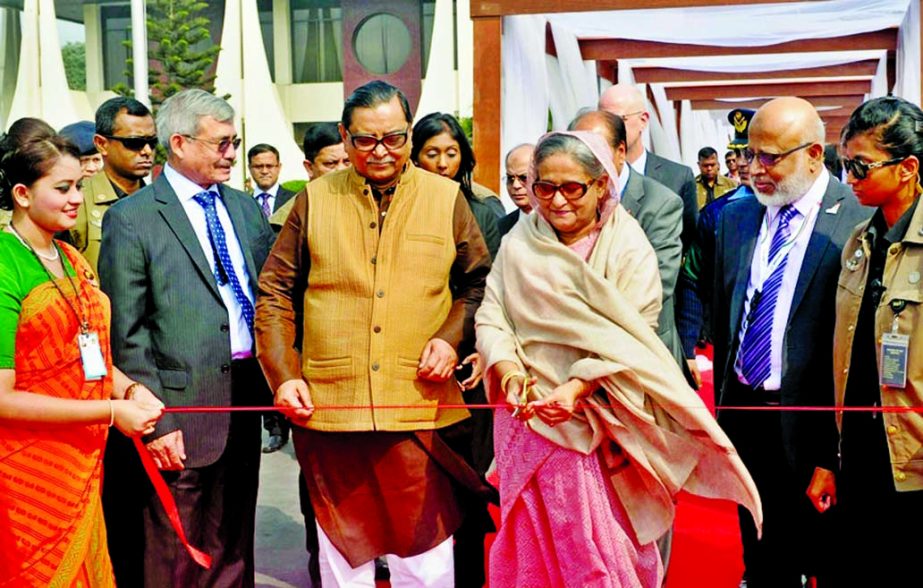 Prime Minister Sheikh Hasina inaugurating the induction of two aircraft 'Meghdoot' and 'Moyurpankhi' into Biman fleet at Hazrat Shahjalal International Airport by cutting ribbon on Tuesday. BSS photo