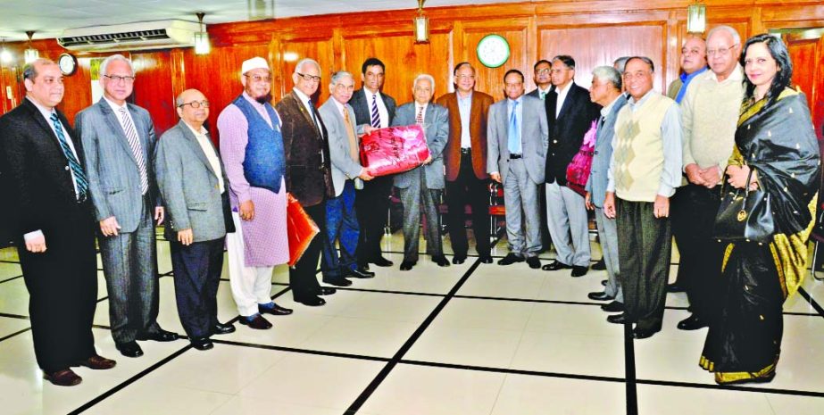 Pubali Bank Ltd. Board of Directors Chairman Hafiz Ahmed Mazumder handing over a sample of blankets to the representative of the relief committee of Anjuman Mufidul Islam at bank's head office in the city recently.