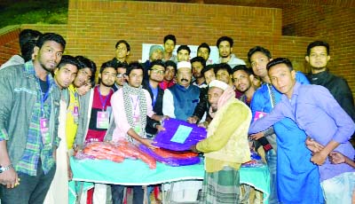 SYLHET: Former Mayor of SCC Badr Uddin Kamran distributing blankets among the cold- hit people organized by Youth Staff Sylhet recently.