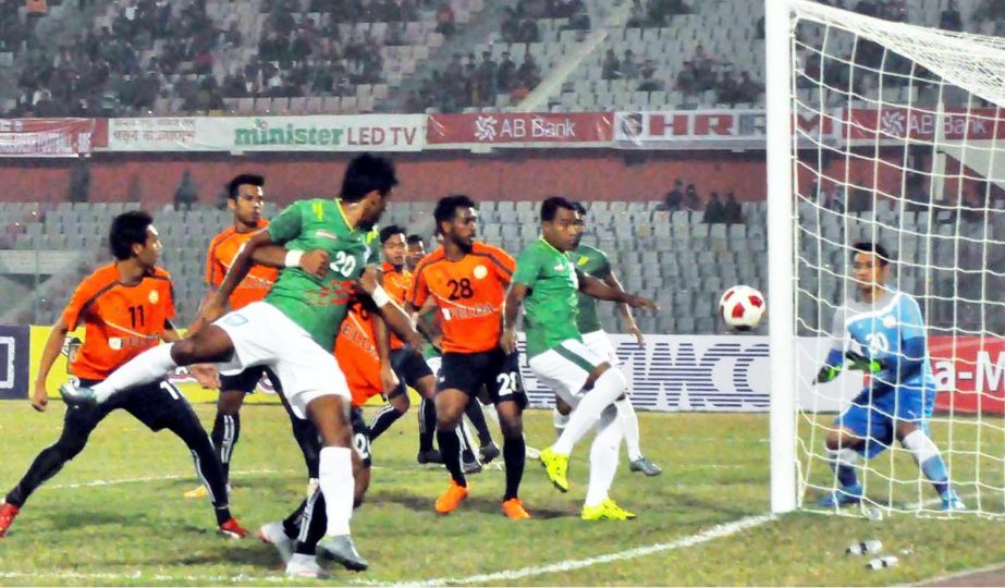 An exciting moment of the match of the Bangabandhu Gold Cup International Football Tournament between Bangladesh and Malaysia at the Bangabandhu National Stadium on Wednesday. The match ended in a 1-1 draw. Banglar Chokh