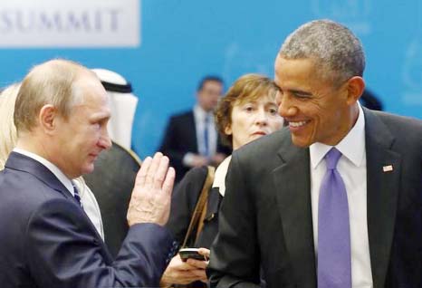 US President Barack Obama (R) chats with Russia's President Vladimir Putin prior to a working session at the Group of 20 (G20) leaders summit in the Mediterranean resort city of Antalya, Turkey.