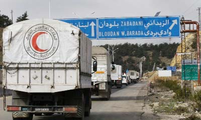 A convoy of aid from the Syrian Arab Red Crescent heads to Madaya on Thursday.