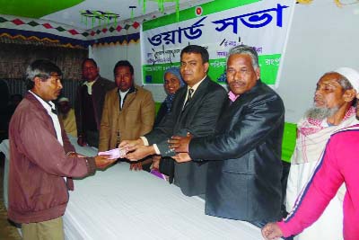 RANGPUR: Tohidul Islam , UNO, Gangachara Sadar Upazila distributing grant money among the distressed people at a function recently.