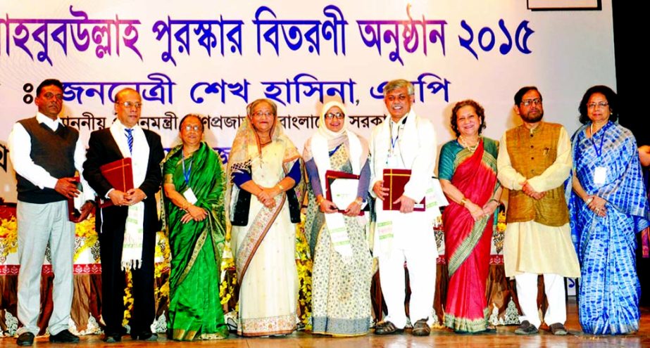 Prime Minister Sheikh Hasina poses for photograph along with the recipients of 'Kazi Mahbub Ullah Award 2015' at Bangladesh Shilpakala Academy in the city on Saturday.