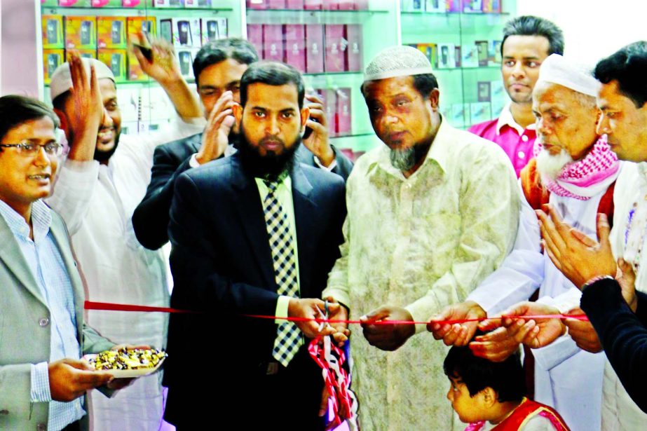 Md. Tofazzul Hossain, Managing Director of Okapia inaugurating a brand shop at Bikrampur Plaza Market, Jurain in the city recently.