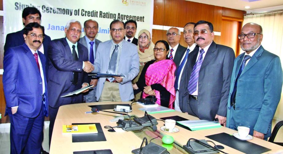 Md. Abdus Salam, Chief Executive Officer and Managing Director of Janata Bank Limited exchanging credit rating agreements with NKA Mobin, Managing Director of Emerging Credit Rating Limited at the committee room of the bank in the city on Sunday.