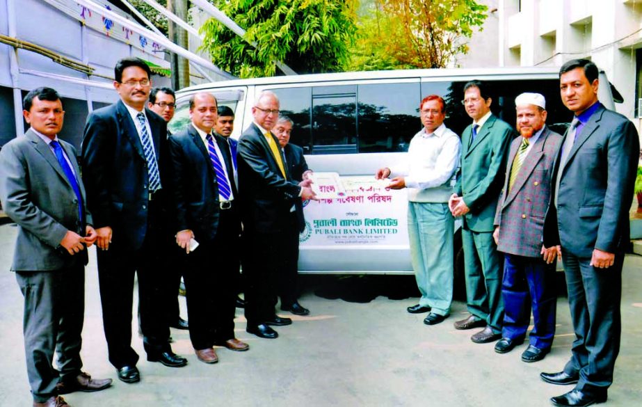 Safiul Alam Khan Chowdhury, Additional Managing Director of Pubali Bank Limited, handing over a key of a microbus to Md Nazrul Islam, Chairman of Bangladesh Council of Scientific and Industrial Research in the city recently.