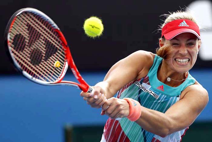 Angelique Kerber of Germany hits a backhand return to Misaki Doi of Japan during their first round match at the Australian Open tennis championships in Melbourne, Australia, Tuesday.