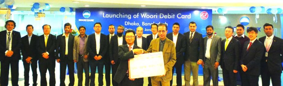 Sun Kyu Kim, Country Manager in Bangladesh of Woori Bank poses at the launching ceremony of its Debit Card for the first time in Bangladesh in Dhaka on Tuesday.
