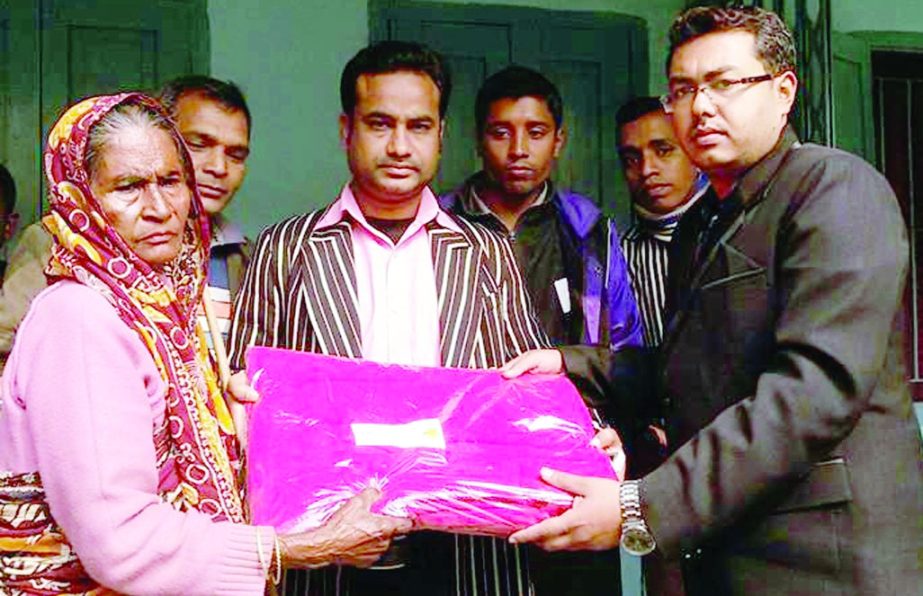 BARISAL: Ayon Saha, Banaripara Upazila Project Implementation Officer distributing blankets among the cold -hit people of the Upazila organised by Disaster Management and Relief Directorate recently.