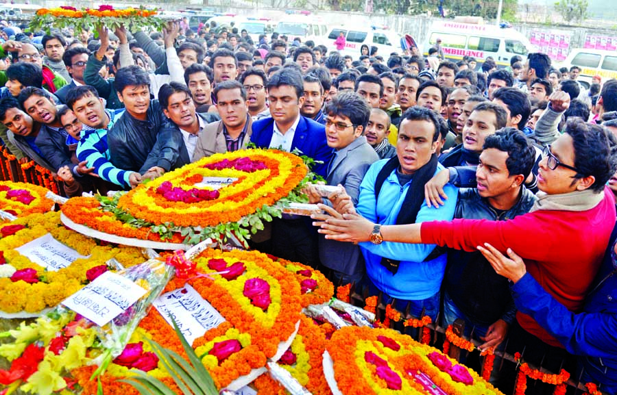 Bangladesh Chhatra League paying tributes to Shaheed Asad by placing floral wreaths at Shaheed Asad Memorial in front of Dhaka Medical College on Wednesday marking Shaheed Asad Day.