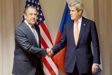 US Secretary of State John Kerry (right) shakes hands with Russian Foreign Minister Sergey Lavrov before their meeting about Syria, in Zurich, Switzerland on Wednesday.