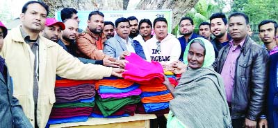 KULAURA( Moulvibazar): Winter clothes are being distributed by United Royal Club , Kulaura among the cold -hit people on Wednesday.