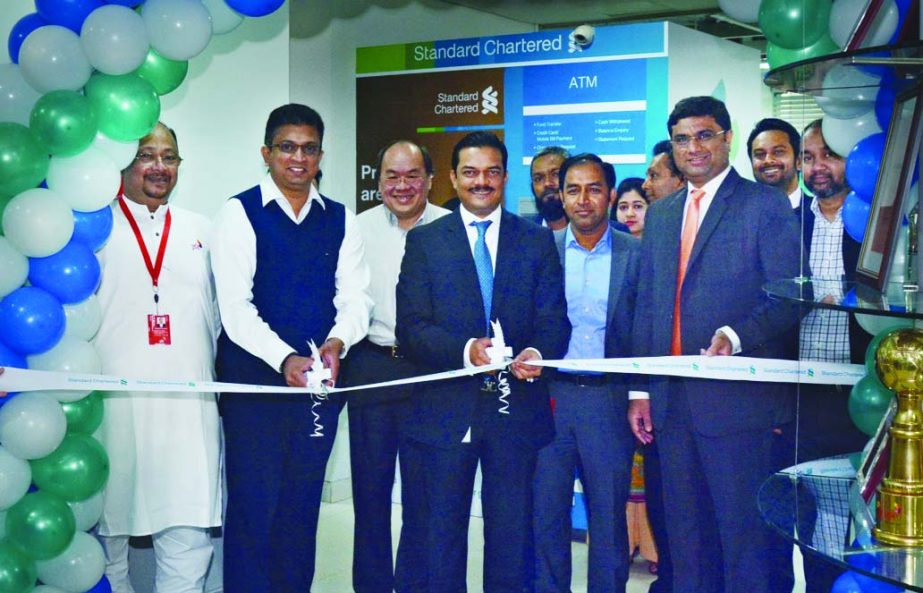 Abrar A Anwar, CEO Aditya Mandloi, Head of Retail Banking of Standard Chartered Bank, Bangladesh and Supun Weerasinghe, CEO, Robi Axiata Limited, inaugurating the new ATM at head office of Robi Axiata Limited at Gulshan on Thursday.