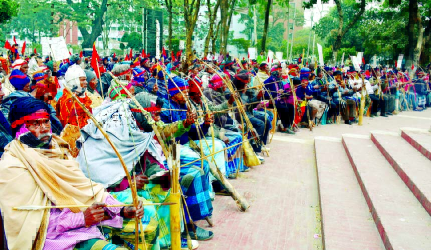 Different organisations including Jatiya Adibashi Parishad organized a rally with bow and arrow at Central Shaheed Minar premises in the city on Saturday with a call to recover 1842.30 acre requisitioned land of Sahebganj-Bagda Farm in Gaibandha.