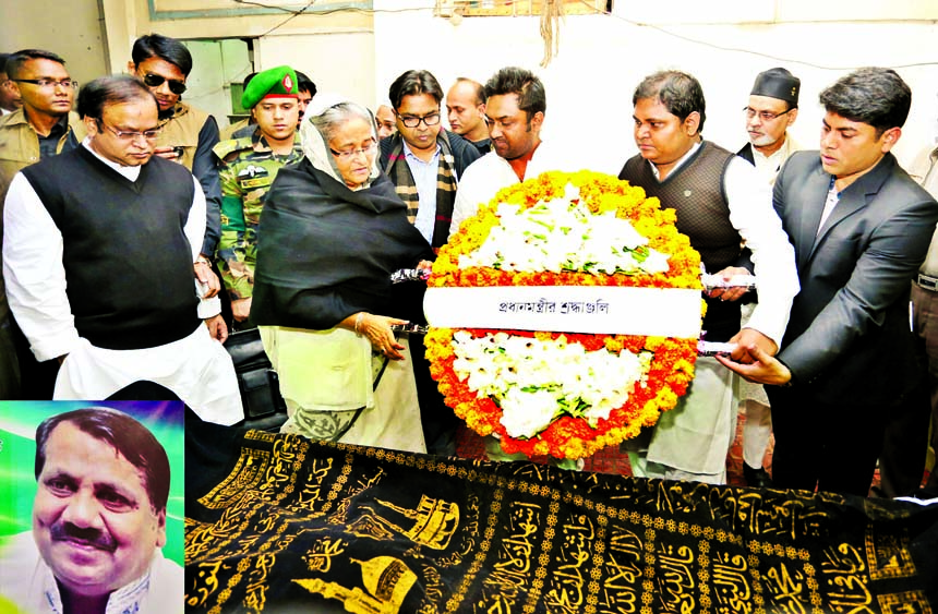 Prime Minister Sheikh Hasina along with party men showing last respect to Acting President of Dhaka city unit Awami League MA Aziz (inset) by placing floral wreaths on his coffin at his Hoseni Dalan residence in the city on Saturday.