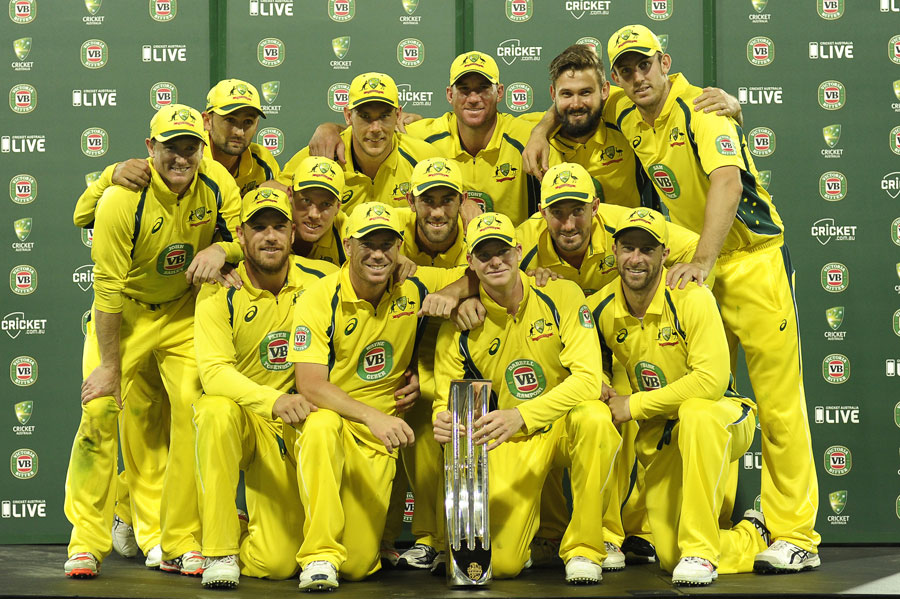 The Australia players pose with the series trophy after 5th ODI against India at Sydney on Saturday.