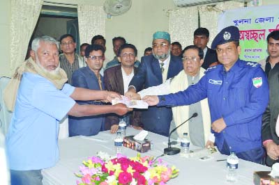 KHULNA: Sheikh Harunur Rashid, Administrator, Khulna Zilla Parishad distributing financial aid among freedom fighters organized by Khulna Zilla Parishad at a function yesterday.