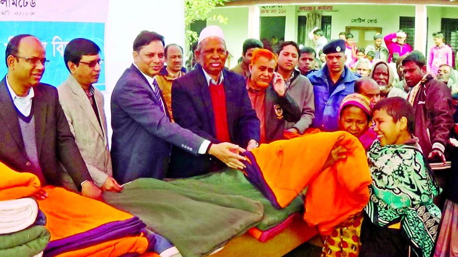 Md. Manjurul Basit, District and Session Judge, Rangpur, distributing blankets among poor and cold-hit people at Shampur VIP Shahadat Hossain College, Rangpur recently. Md. Shahadat Hossain, Director of Prime Bank was present on the occasion.