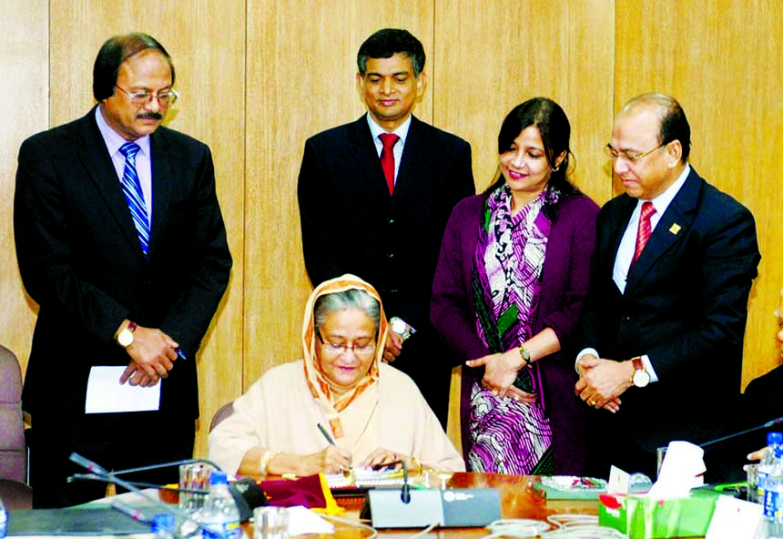 Prime Minister Sheikh Hasina releasing commemorative postage stamp at Cabinet Division Conference Room marking International Customs Day.