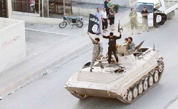 The Islamic State activists parading with the Jihadist flag at an undisclosed location