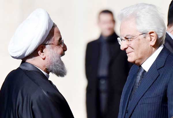 Iranian President Hassan Rouhani (L) is welcomed by Italian President Sergio Mattarella on his arrival at the Quirinale presidential palace in Rome on Monday.