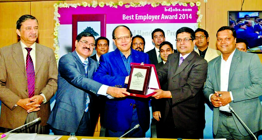Bangladesh Bank Governor Dr Atiur Rahman receiving medal of "Best Employer Award-2014"" form Bdjobs.com at BB office on Tuesday. Deputy Governor Abul Kasem was present."