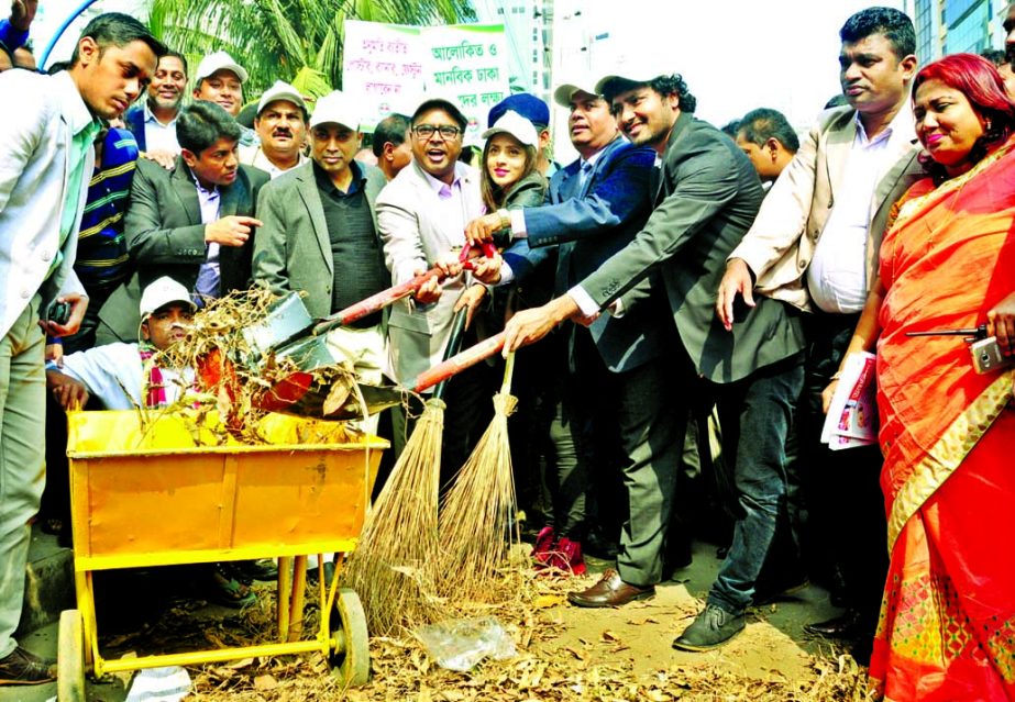 Dhaka South City Corporation (DSCC) Mayor Mohammad Sayeed Khokon, among others, at a cleanliness drive organized by DSCC in the city's Motijheel area on Tuesday to make the clean year-2016 programme a success.