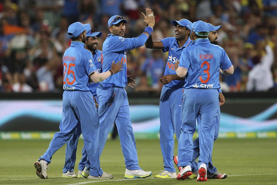 Yuvraj Singh (3rd from left) takes a high-five during the 1st T20 international between Australia and India at Adelaide on Tuesday.
