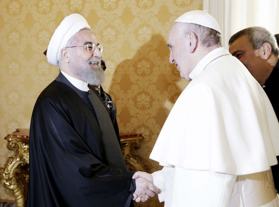 Pope Francis shaking hands Iran's president at the Vatican on Tuesday.