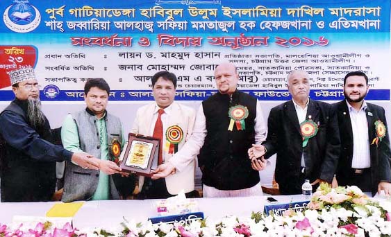 Founder President of East Gatiyadanga Habibul Alam Madrasa and Shah Jabbaria Safia Mamtajul Hoque Hefzkhana and Ethimkhana Alhaj Abul Bashar Abu seen handing over crest to the newly -elected Satkania Municipality Mayor Md. Zubair recently.