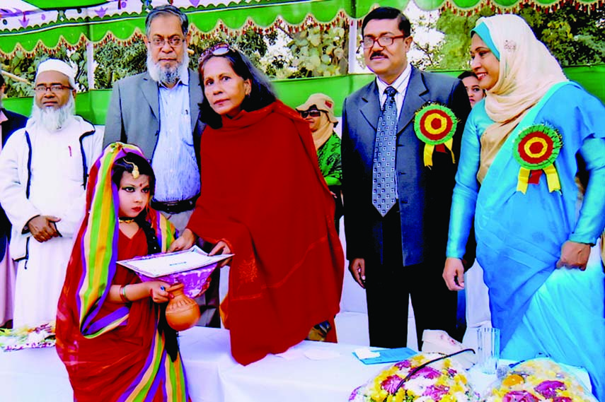 Vice-Chancellor of BUET Professor Khaleda Ekram handing over a prize to a winner of the Annual Athletics Competition of Engineering University Girls' School as the chief guest at the BUET play ground on Tuesday. Chairman of the School Managing Committee