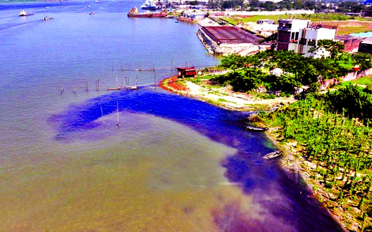 Untreated chemical wastes being dumped by the factories near the DND project that links River Sitalakkhya creating pollution threat. This photo was taken from near Kanchpur area on Wednesday.