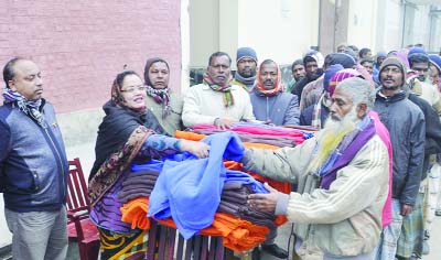DINAJPUR: Hasmin Luna, Vice Chairman, Dinajpur Sadar Upazila distributing blankets at Pulhat LSD Food Godown donated by Iqbalur Rahim MP , Whip, National Parliament on Tuesday.