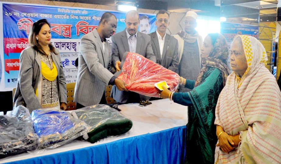 CCC Mayor AJM Nasir Uddin distributing winter clothes among the cold -hit people at Dewan Bazar area on Wednesday.