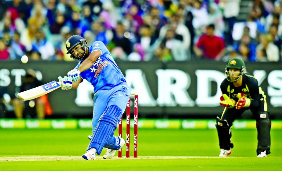 Rohit Sharma of India (L) bats during the second Twenty20 international cricket match between Australia and India at Melbourne on Friday.