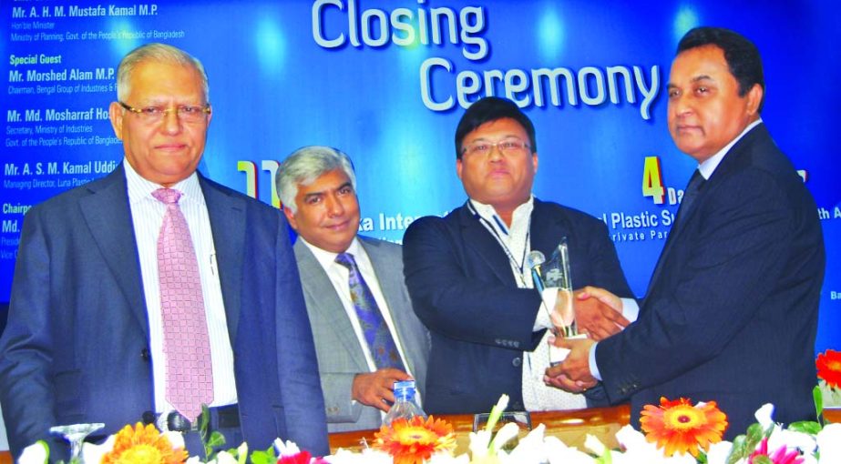 Habibur Rahman, President & CEO of Techno Plast Consultancy, receiving crest from planning minister AHM Mostafa Kamal MP as a foreign participant at the closing ceremony of International Plastic Summit-2016 held recently at Bangabandhu International Confe