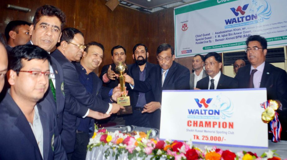 Home Minister Asaduzzaman Khan Kamal, MP distributing trophy to the champions team Sheikh Russell Memorial Sporting Club at Bangladesh Chess Federation hall room on Sunday.