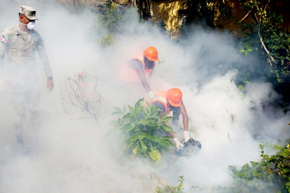 Dominican Air Force personnel fumigate various locations in Santo Domingo against mosquitoes carrying the Zika virus.