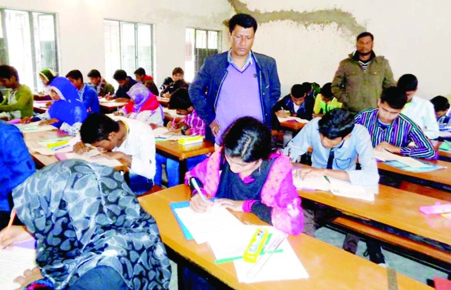 SAPAHAR (Naogaon): Md Shafiqual Islam, Upazila Education Officer visiting a SSC examination centre at Govt Girls' High School on the first day of SSC examination yesterday.