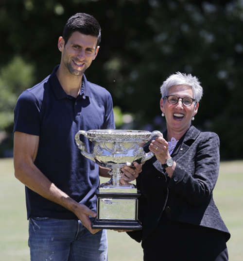 Serbia's Novak Djokovic and the Governor of Victoria Linda Dessau hold his Australian Open trophy at Government House in Melbourne, Australia on Monday. Djokovic defeated Britain's Andy Murray in the men's final at the Australian Open tennis championsh
