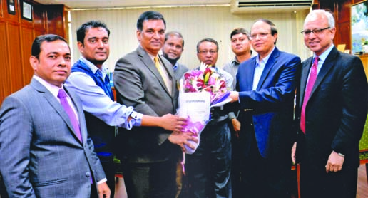 Md Abdul Halim Chowdhury, Managing Director of Pubali Bank Limited, greeting Bangladesh Bank Governor Dr Atiur Rahman for getting 'Bangla Academy Literature Award 2015'. Additional Managing Director of the bank Safiul Alam Khan Chowdhury was present.