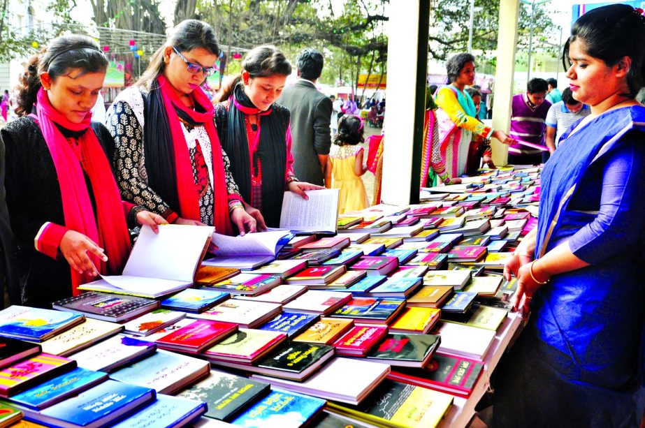 On the second day of Ekushey Boi Mela book-lovers visiting stalls.