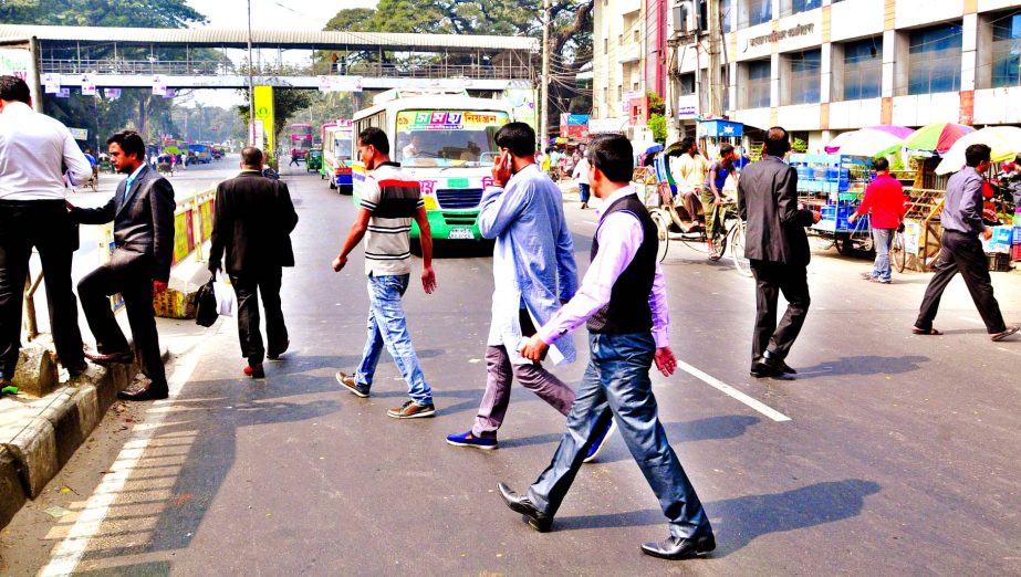 Despite frequent fatalities some people have the least care for life as they recklessly cross major city intersections ignoring approaching vehicles. This picture has been taken from in front of Jatiya Press Club on Tuesday.