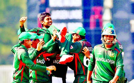 Mehedi Hasan Miraz (top) of Bangladesh Under-19 Cricket team along with his teammates celebrating his making new world record during their fight against Namibia at Sheikh Kamal International Stadium in Cox's Bazar on Tuesday.