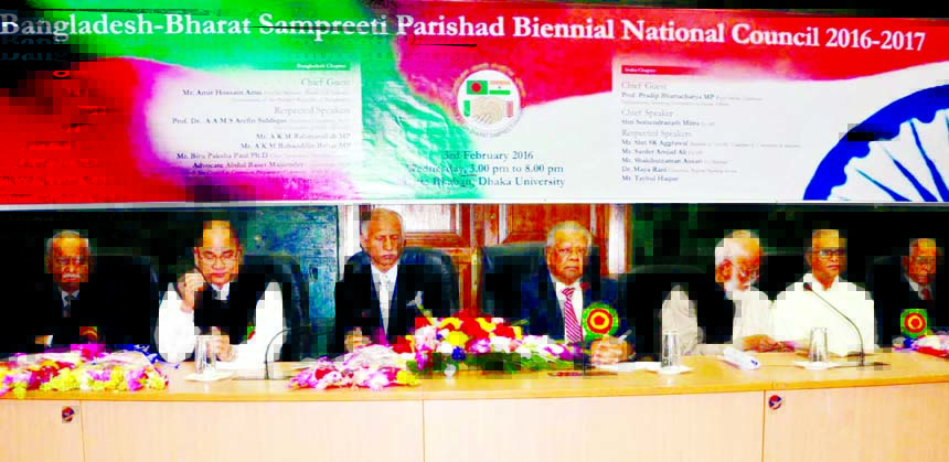 Industries Minister Amir Hossain Amu, among others, at a seminar on 'Bangladesh-Bharat Sampreeti Parishad Biennial National Council 2016-2017' at Senate Bhaban of Dhaka University on Wednesday.